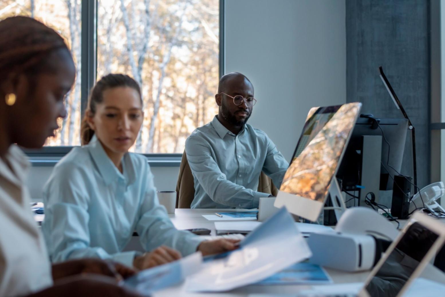 Financial planning session with participants reviewing budget strategies